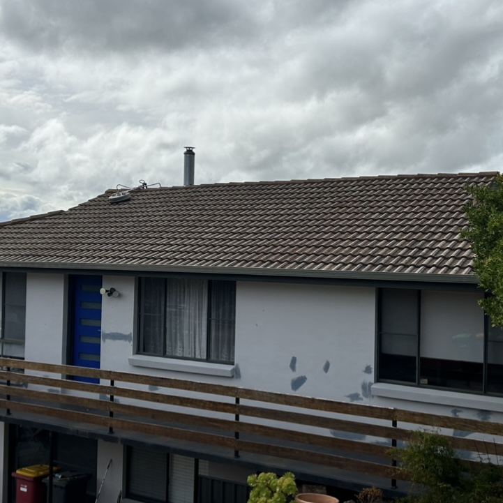 Aged grey tile roof before restoration